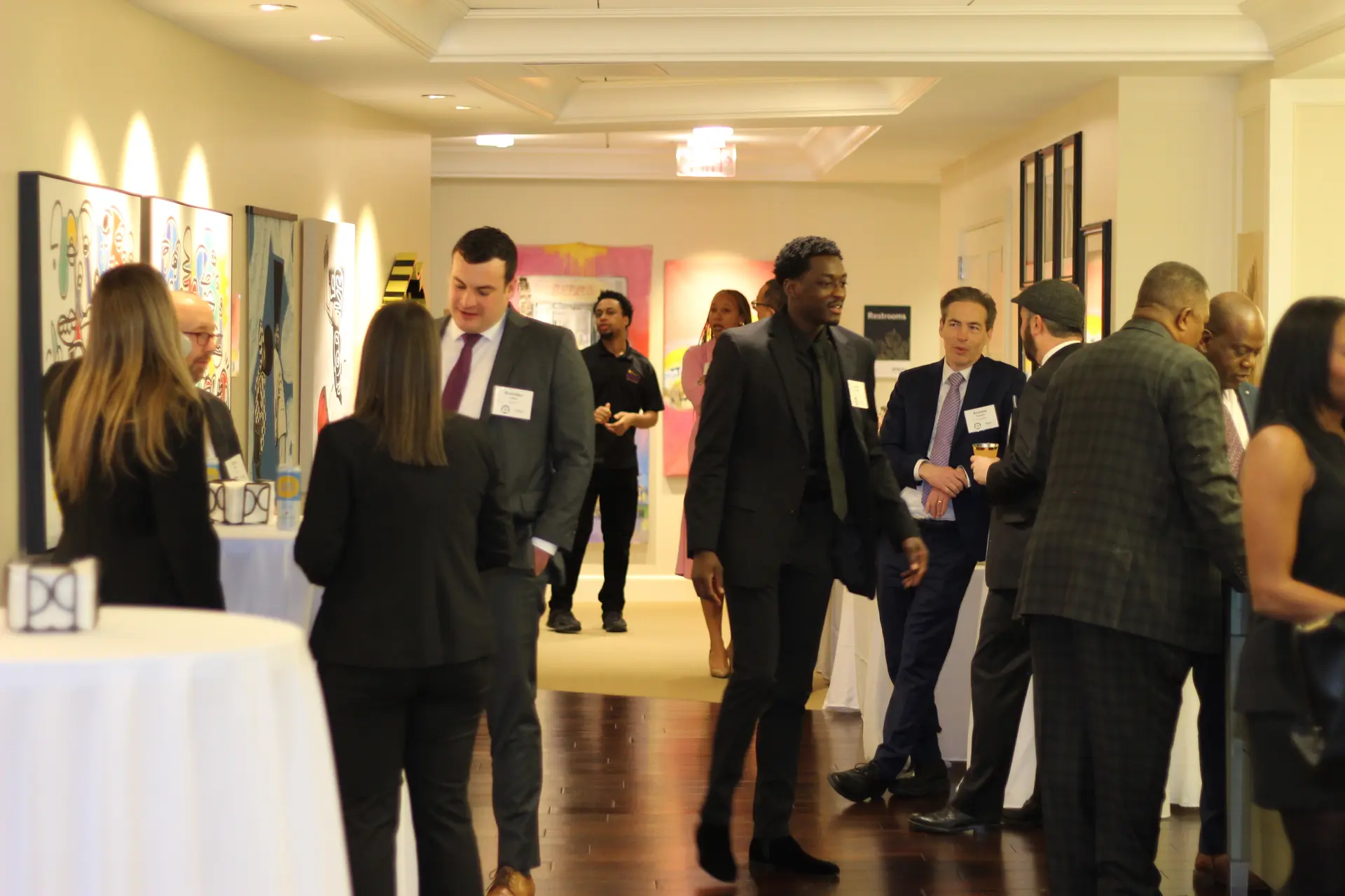 Attendees networking and socializing at gala reception